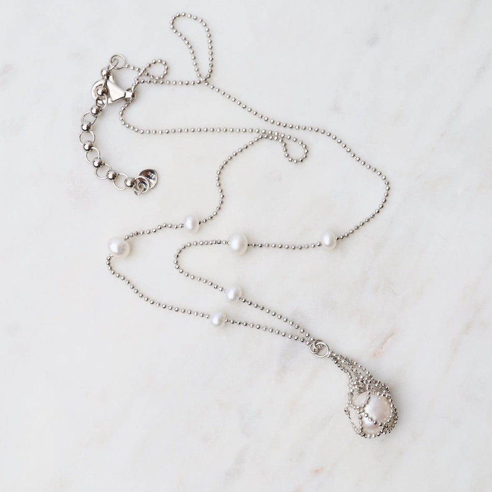 
                      
                        NKL Simple Pearl Stations with Captured White Pearl Necklace
                      
                    