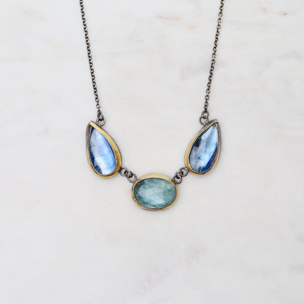 
                      
                        NKL Sky Blue Kyanite 3 Stone Teardrop & Oval Crescent Rim Necklace
                      
                    