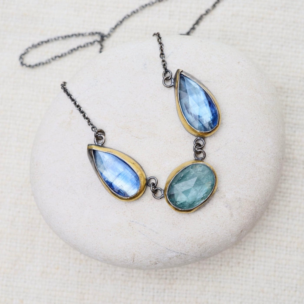 
                      
                        NKL Sky Blue Kyanite 3 Stone Teardrop & Oval Crescent Rim Necklace
                      
                    