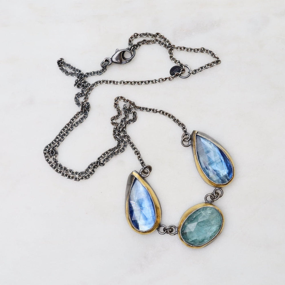 
                      
                        NKL Sky Blue Kyanite 3 Stone Teardrop & Oval Crescent Rim Necklace
                      
                    