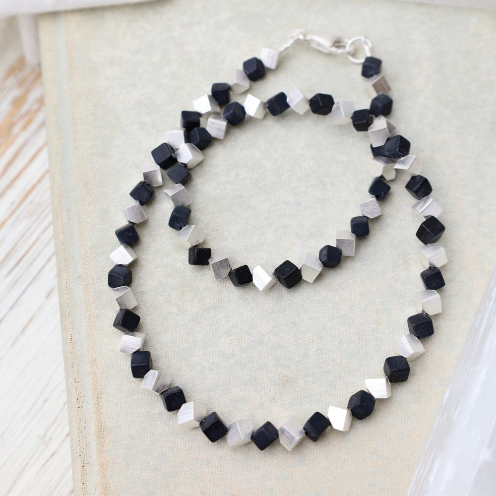 
                      
                        NKL Small Cube and Onyx Necklace
                      
                    