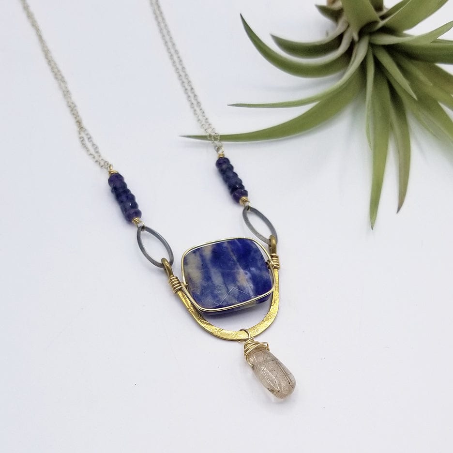 NKL SODALITE SQUARE SET IN A BRASS "U" WITH RUTILATED QUARTZ DROP NECKLACE