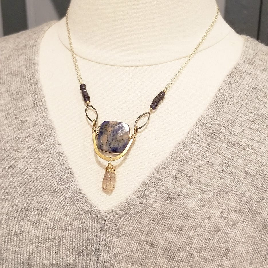 Load image into Gallery viewer, NKL SODALITE SQUARE SET IN A BRASS &amp;quot;U&amp;quot; WITH RUTILATED QUARTZ DROP NECKLACE
