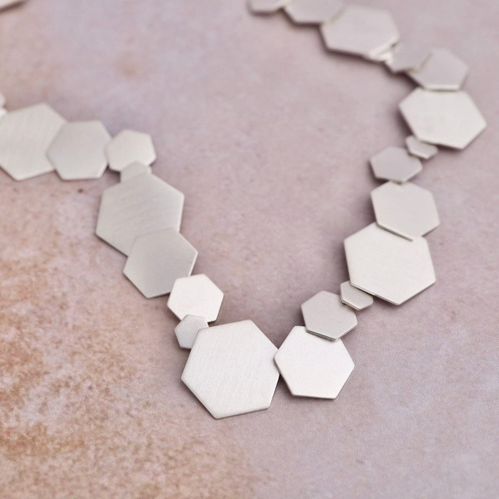 
                      
                        NKL Solid Hex Necklace
                      
                    