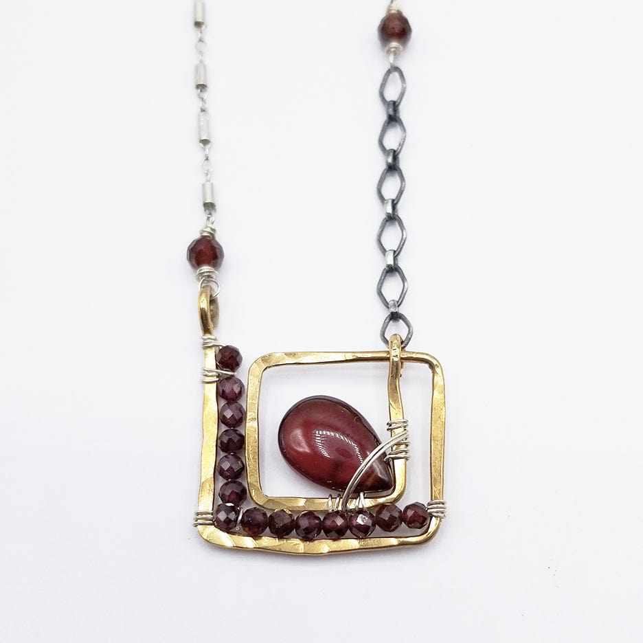 NKL SQUARE SPIRAL WITH CARNELIAN DROP AND FACETED GARNETS NECKLACE
