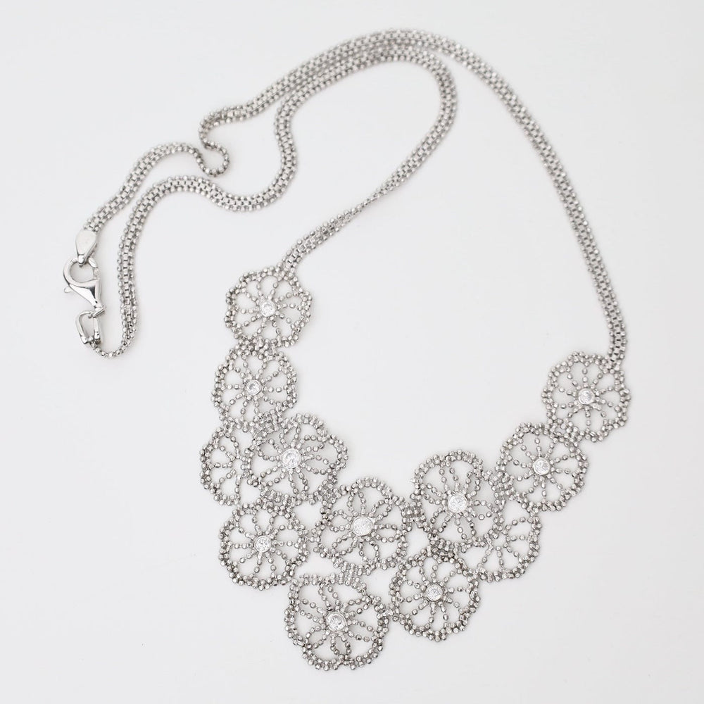 
                  
                    NKL Sterling Sand Dollar Lace & Cubic Zirconia Necklace
                  
                