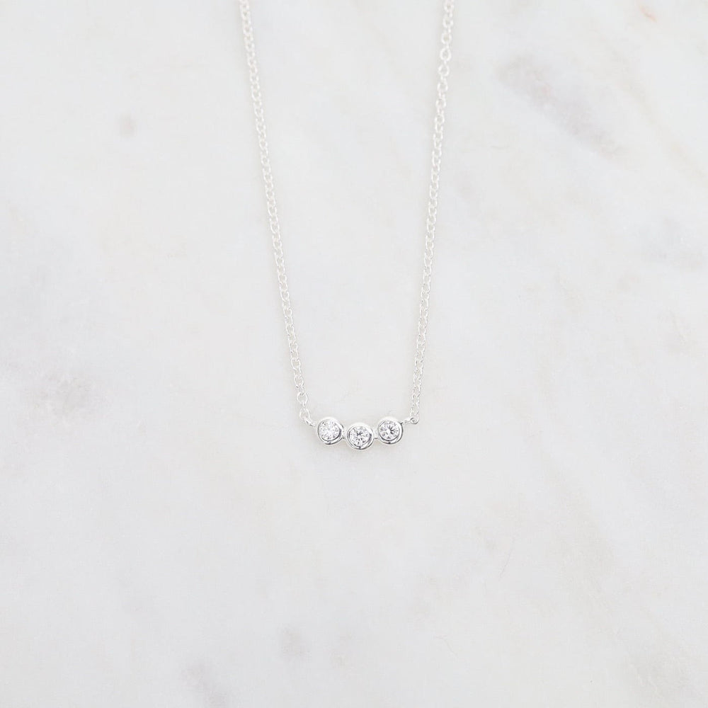 
                      
                        NKL Sterling Silver 3 Bezel Set CZ Necklace
                      
                    