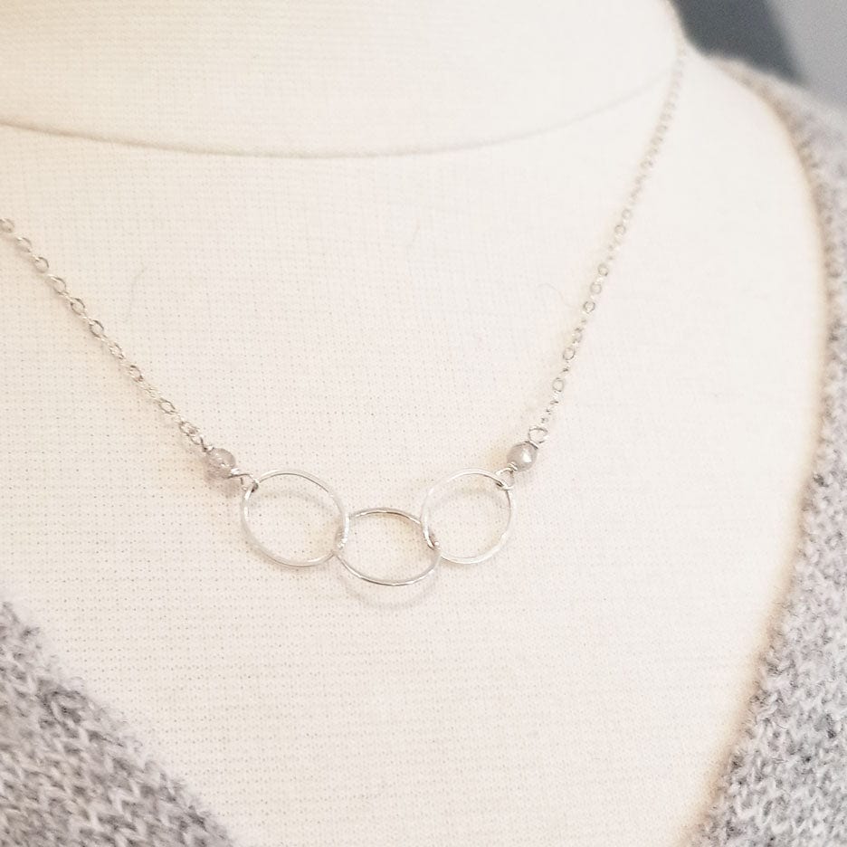 
                      
                        NKL Sterling Silver 3 Ring Necklace
                      
                    