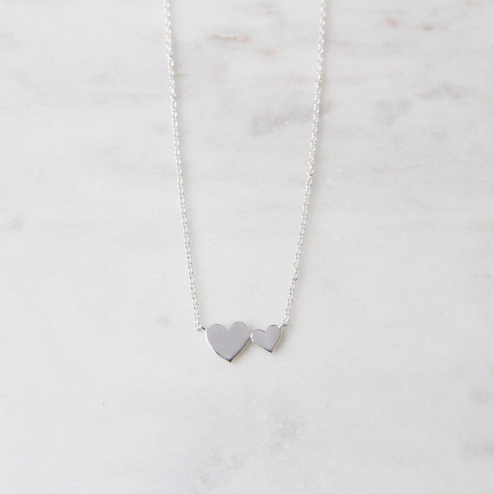 
                      
                        NKL Sterling Silver Big & Little Hearts Necklace
                      
                    