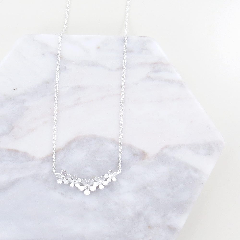 
                      
                        NKL Sterling Silver Curve of Forget-me-nots Necklace
                      
                    