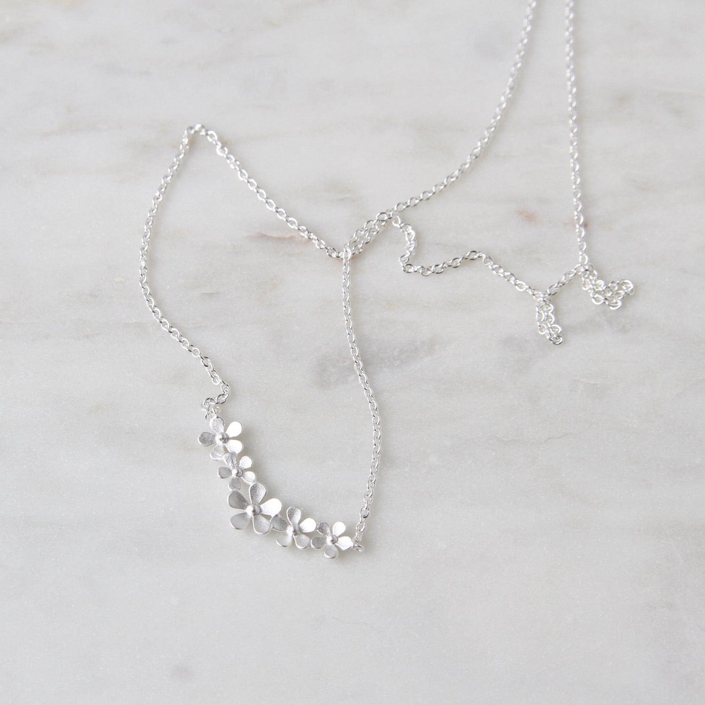 NKL Sterling Silver Curve of Forget-me-nots Necklace