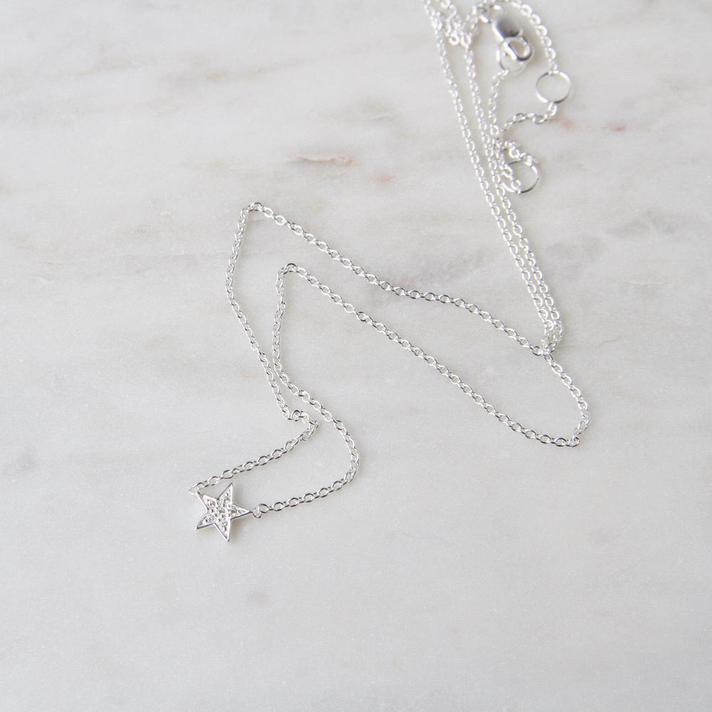 
                  
                    NKL Sterling Silver CZ Pavé Star Necklace
                  
                