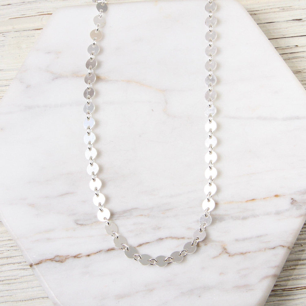 
                      
                        NKL Sterling Silver Disc Choker
                      
                    