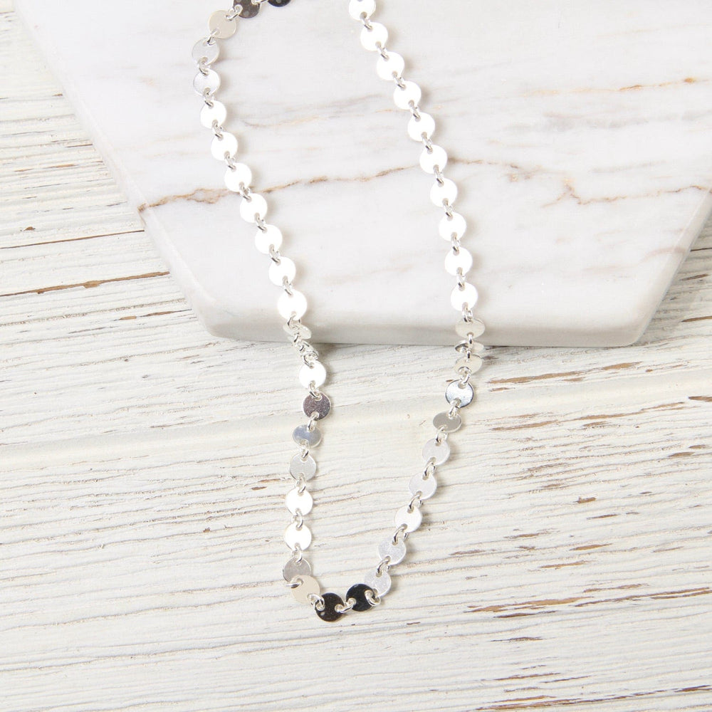 
                      
                        NKL Sterling Silver Disc Choker
                      
                    