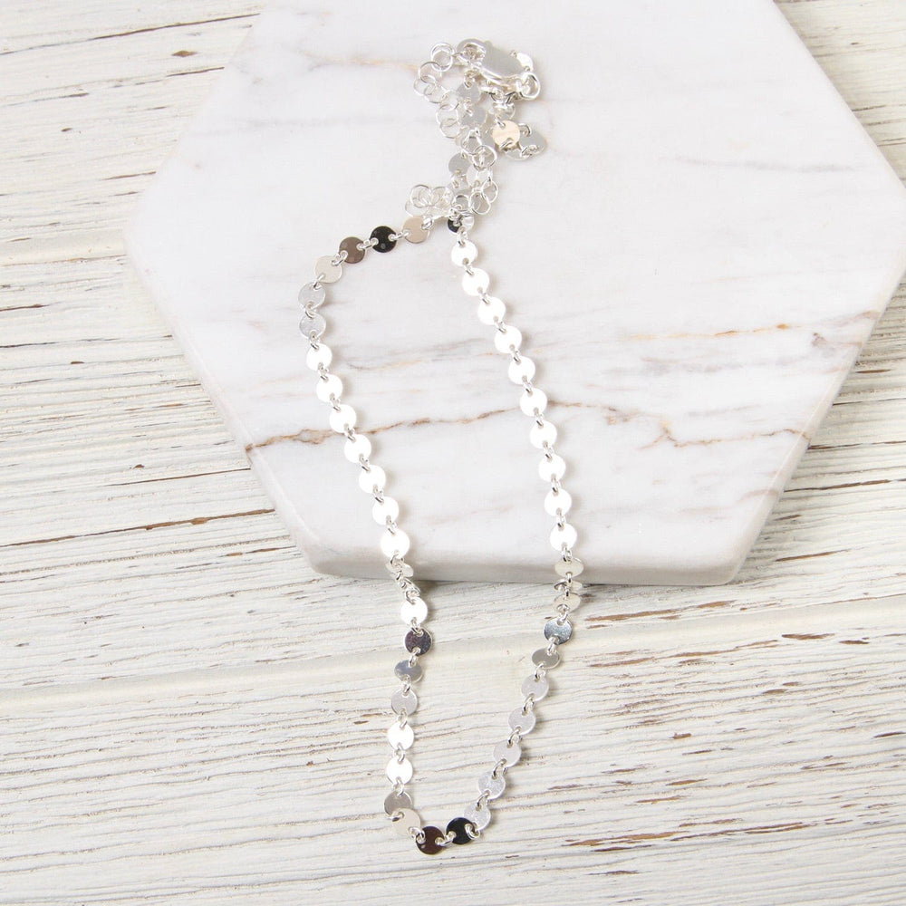 
                      
                        NKL Sterling Silver Disc Choker
                      
                    