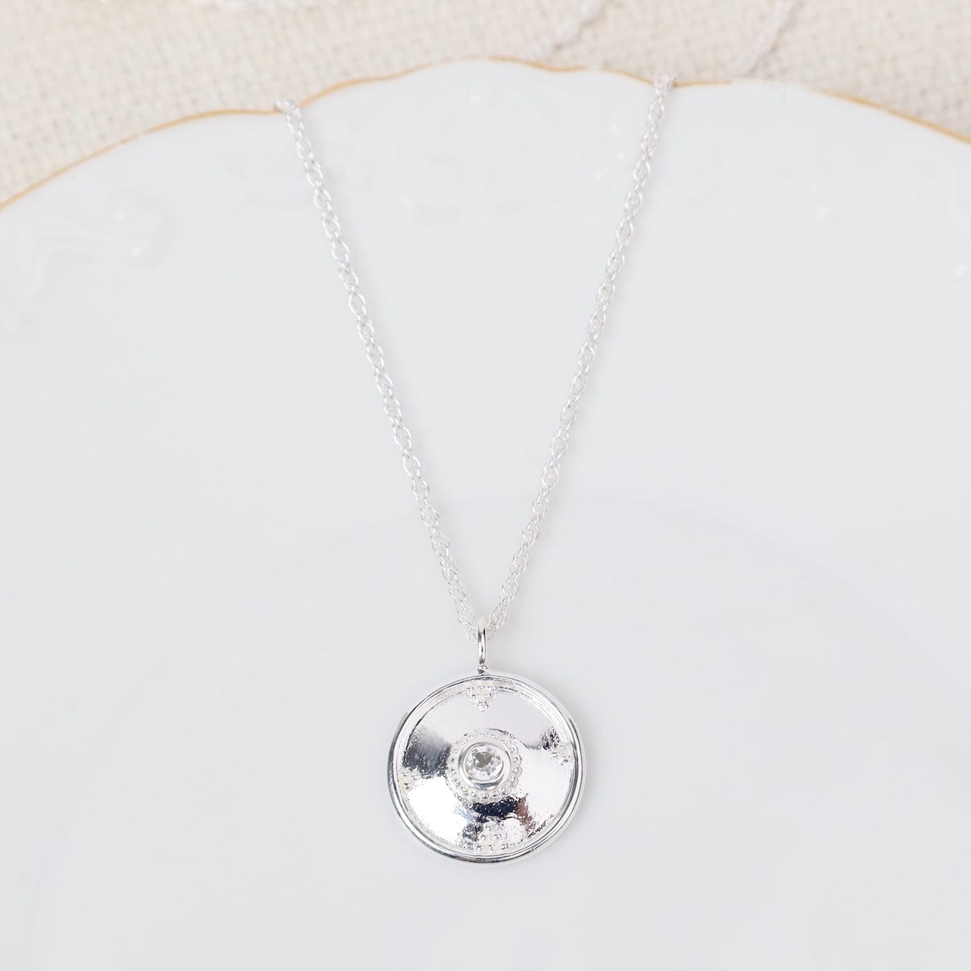 NKL Sterling Silver Dotted Dome Disc with White Topaz Necklace