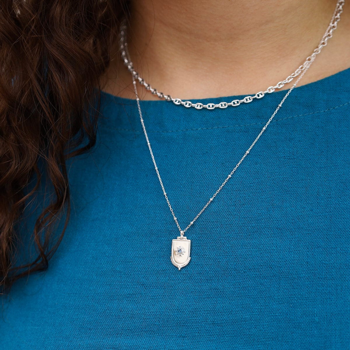 NKL Sterling Silver Dotted Shield Necklace With Blue Sapphire