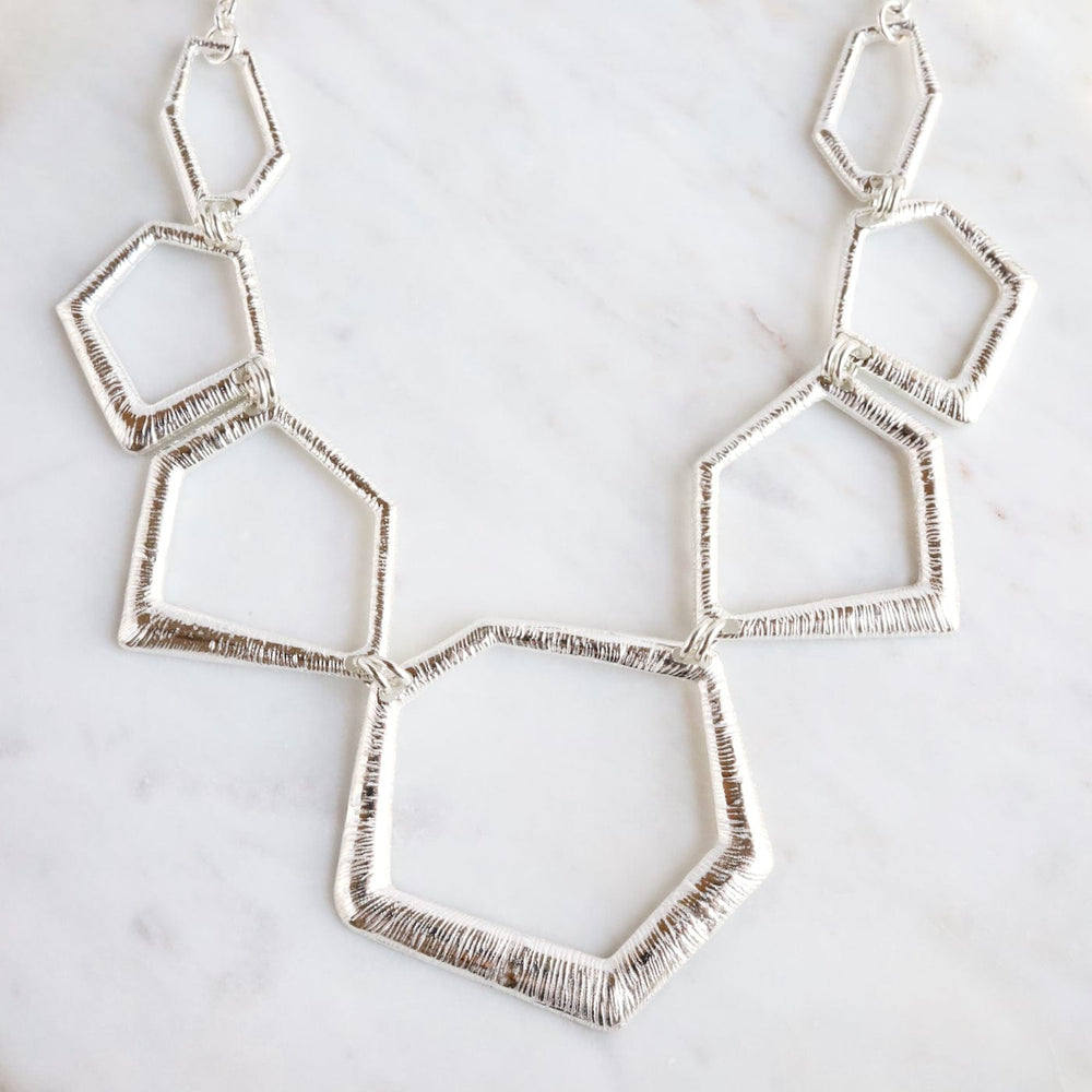 
                      
                        NKL Sterling Silver Graduating Geometric Shapes Necklace
                      
                    