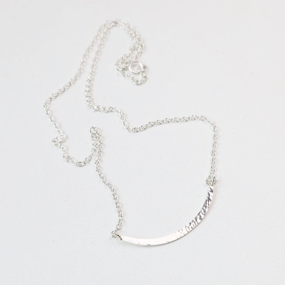 
                  
                    NKL Sterling Silver Hammered Curved Bar Necklace
                  
                