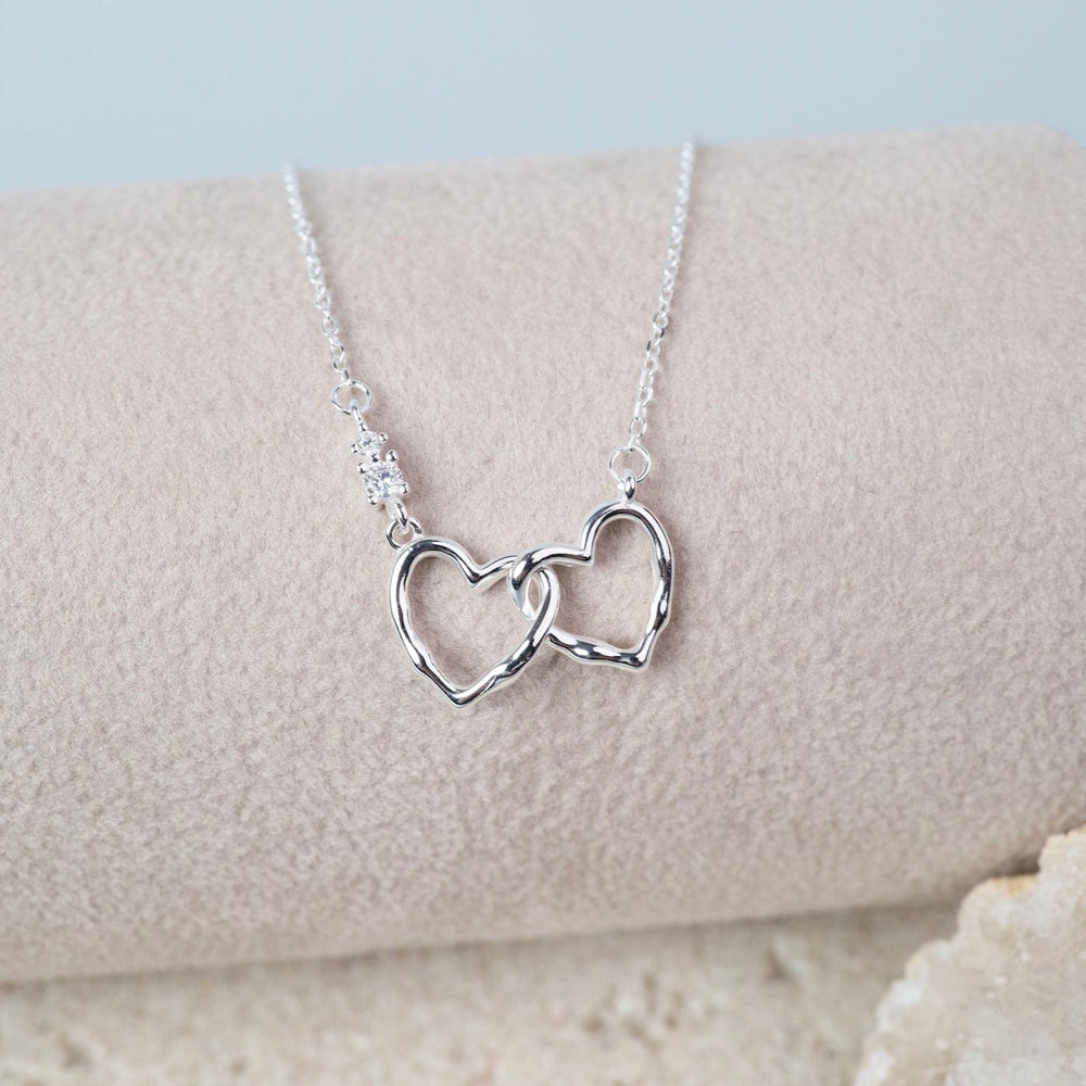 
                  
                    NKL Sterling Silver Interlocking Hearts Necklace
                  
                