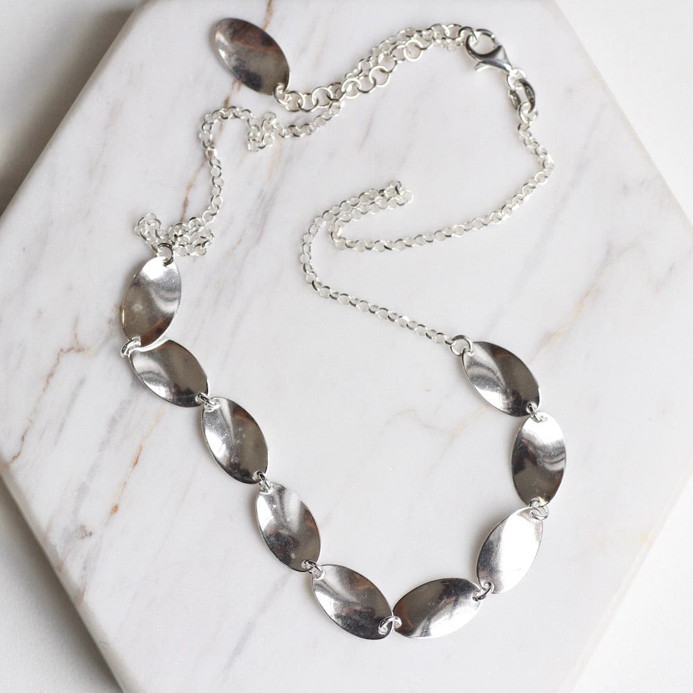 
                  
                    NKL Sterling Silver Necklace with Oval Tabs
                  
                