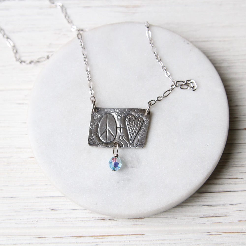 
                      
                        NKL Sterling Silver Peace and Love Necklace
                      
                    