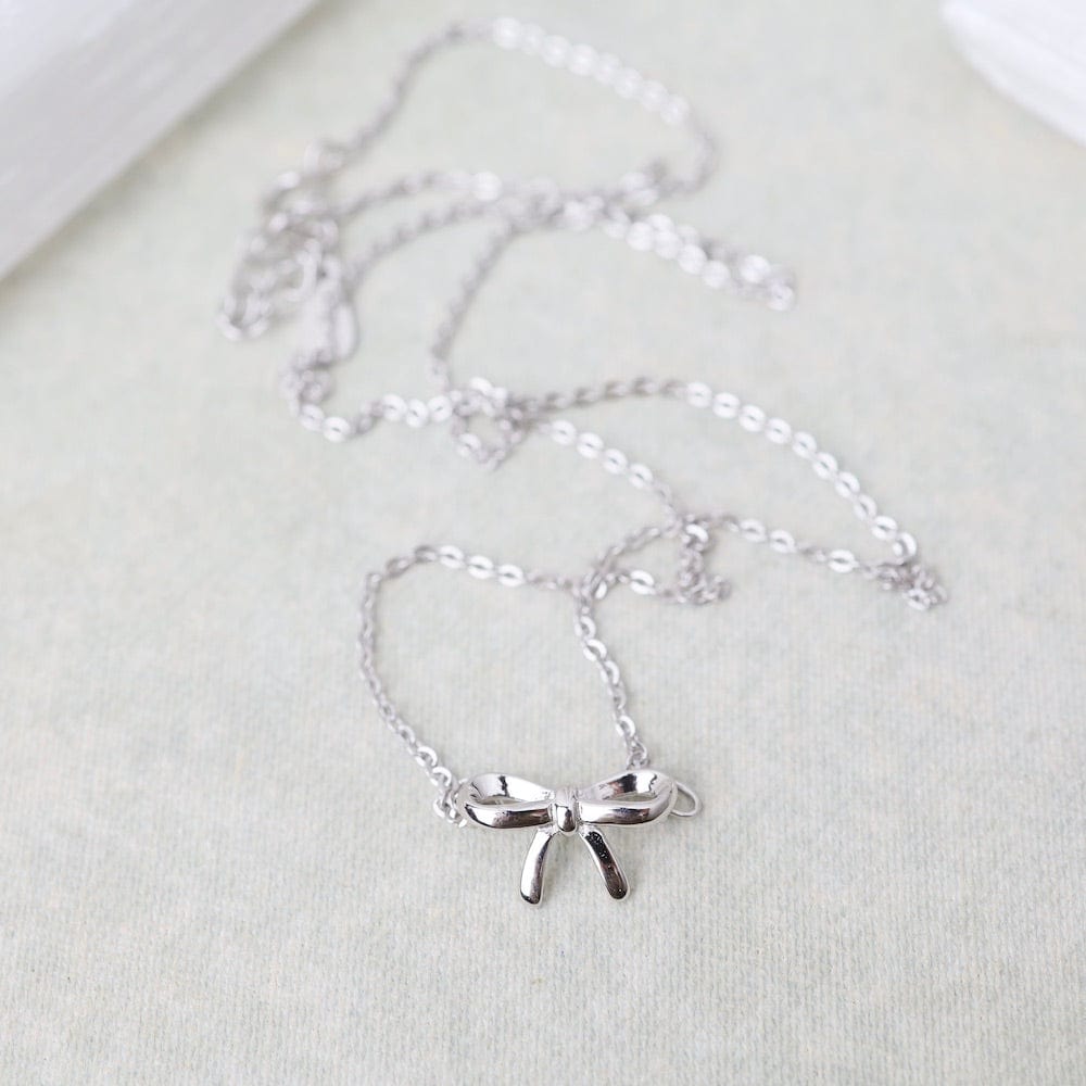 
                  
                    NKL Sterling Silver Tiny Bow Necklace
                  
                