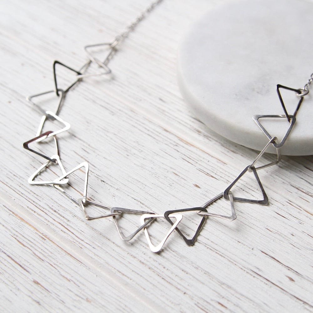 
                  
                    NKL Sterling Silver Triangle Link Necklace
                  
                