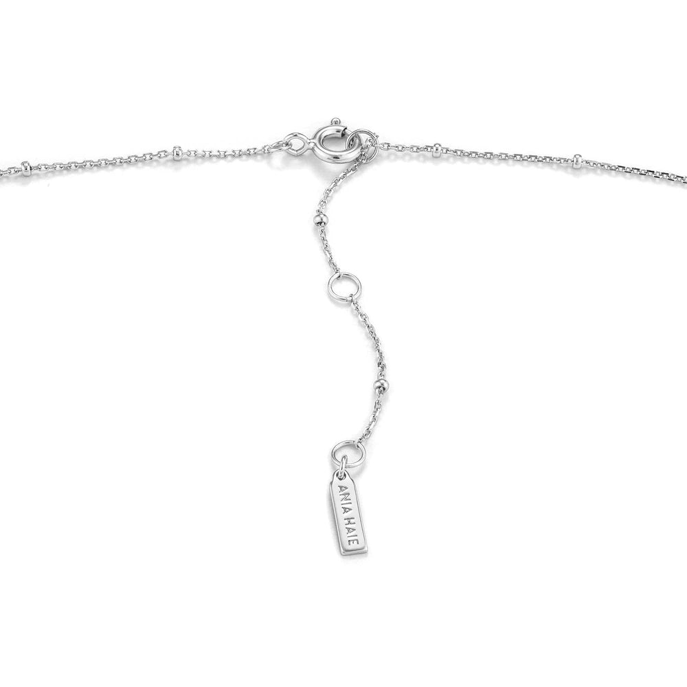 
                      
                        NKL Sunbeam Emblem Silver Necklace
                      
                    