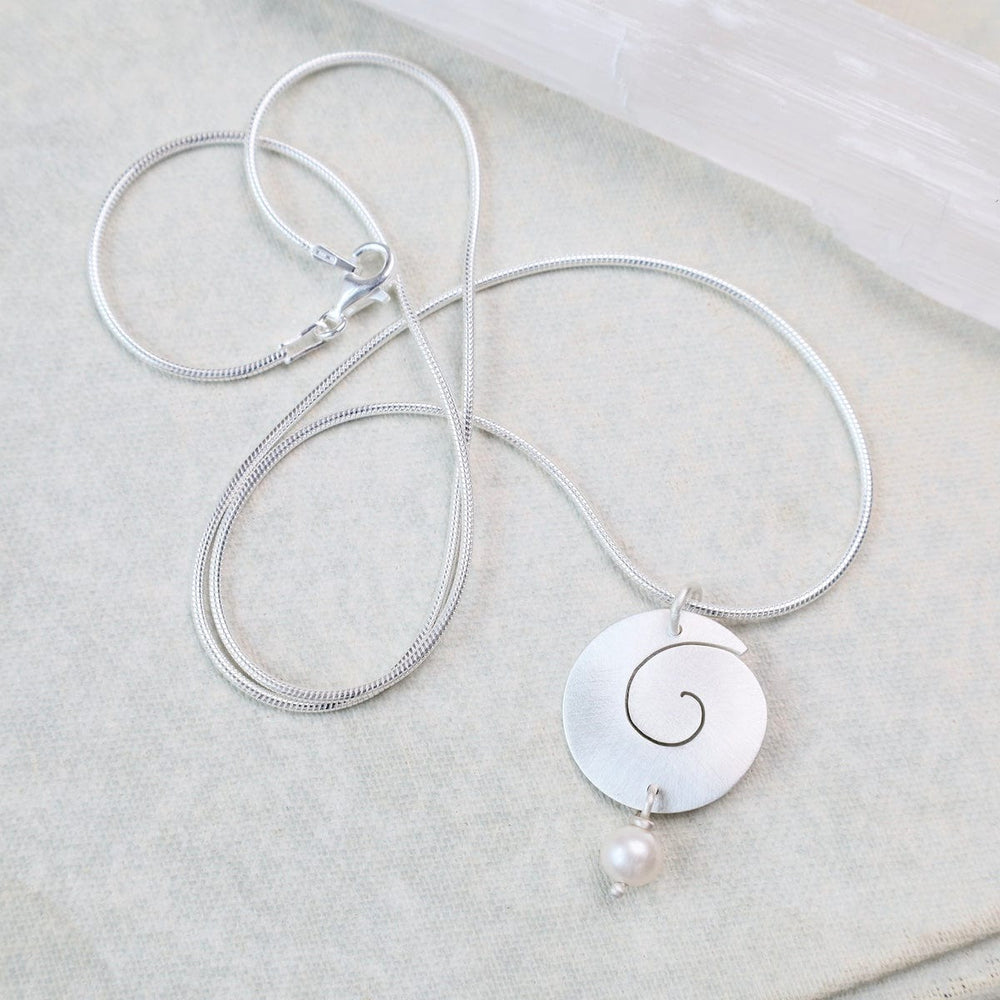 
                      
                        NKL SWIRL PENDAND WITH PEARL DROP
                      
                    