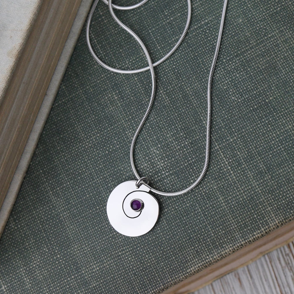 
                      
                        NKL Swirl Pendant with Amethyst
                      
                    