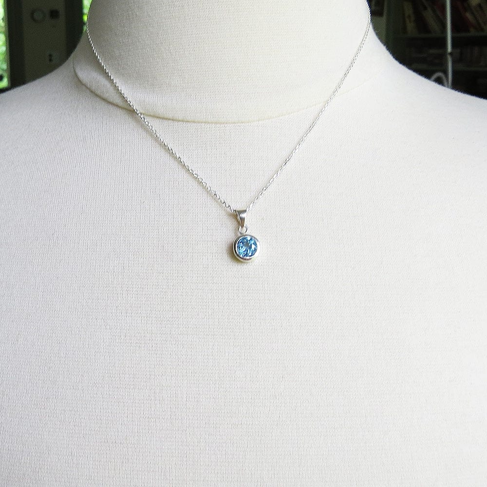 
                      
                        NKL Swiss Blue Topaz Dot Pendant
                      
                    