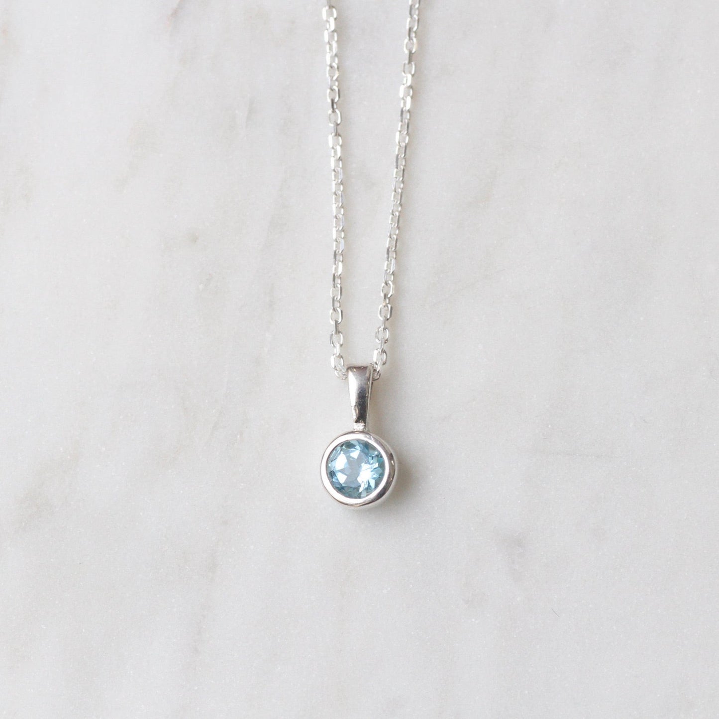 NKL Swiss Blue Topaz Pendant