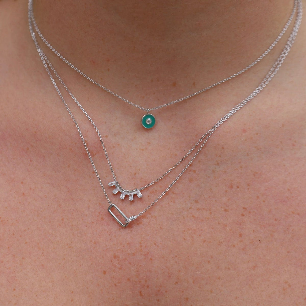 
                      
                        NKL Teal Enamel Disc Silver Necklace
                      
                    