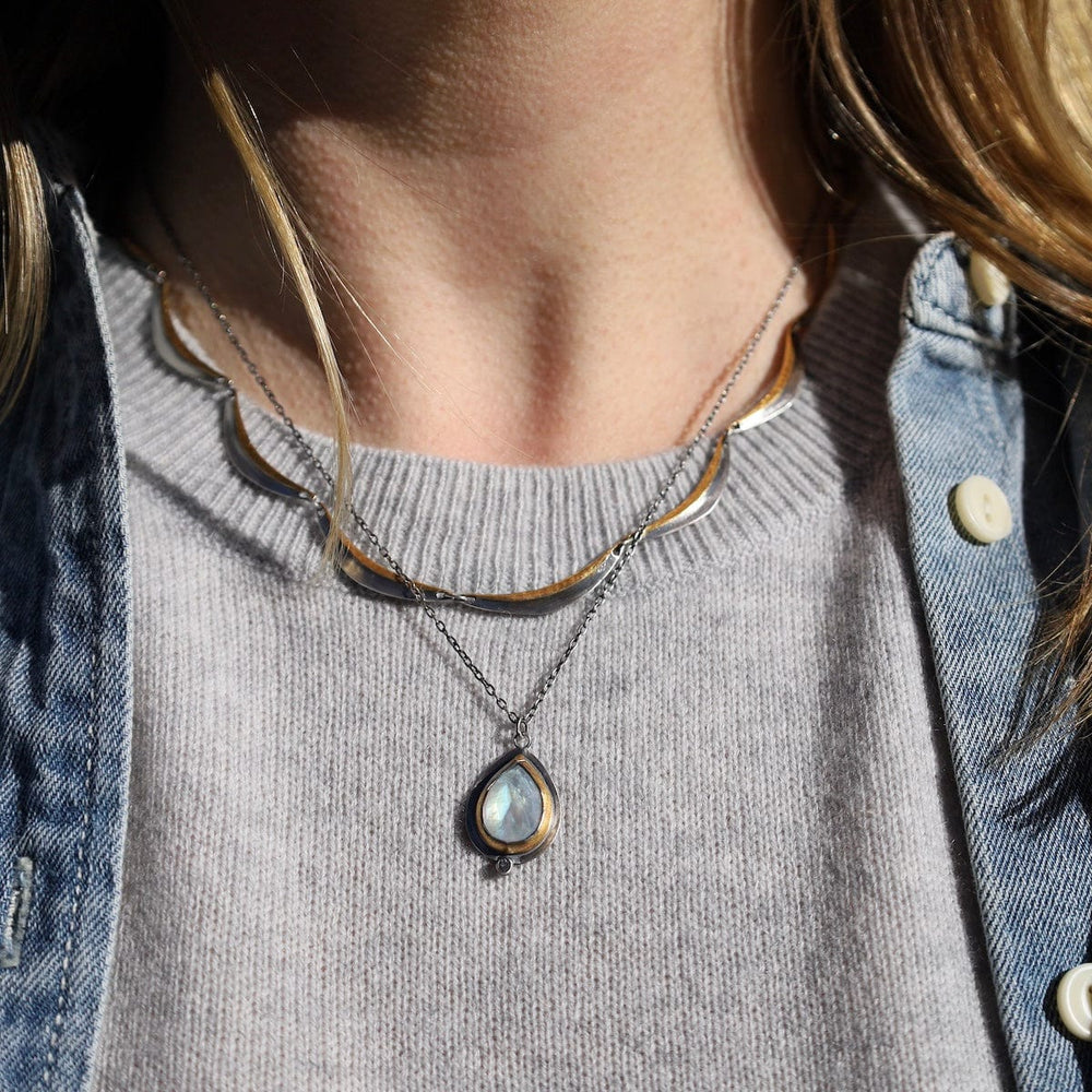 
                      
                        NKL Teardrop Rim Necklace in Moonstone
                      
                    