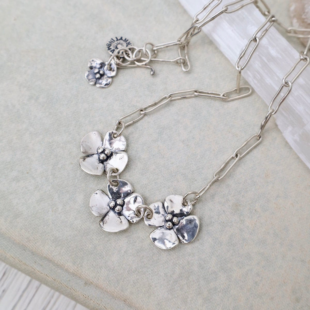 
                  
                    NKL Three Dogwood Flower Necklace on Short Oval Chain
                  
                