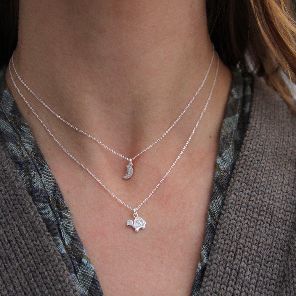 
                  
                    NKL Tiny Crescent Moon Necklace
                  
                