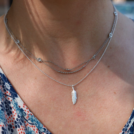 NKL Tiny Feather Necklace - Brushed Sterling Silver