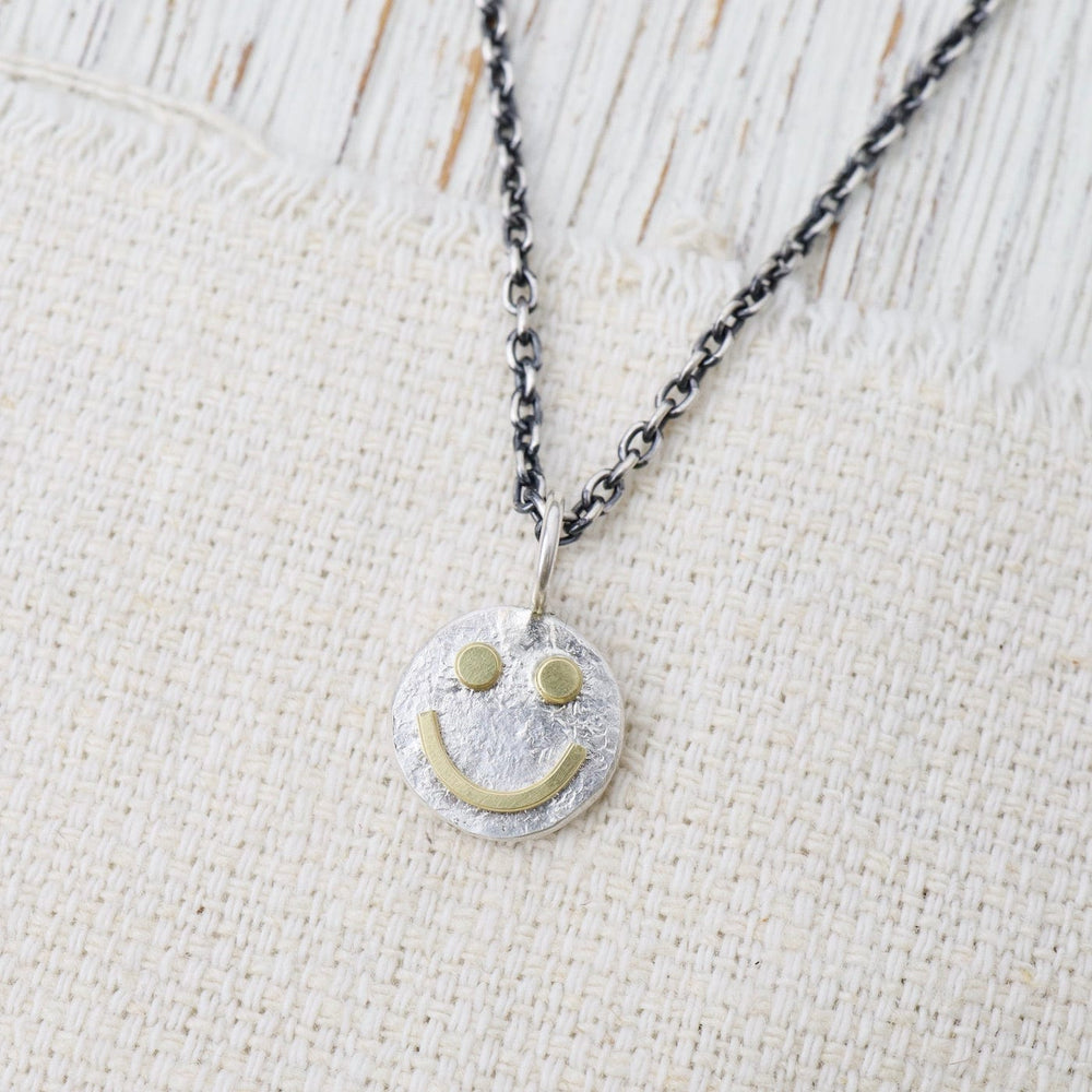 
                      
                        NKL Tiny Happy Face Necklace in Sterling Silver
                      
                    