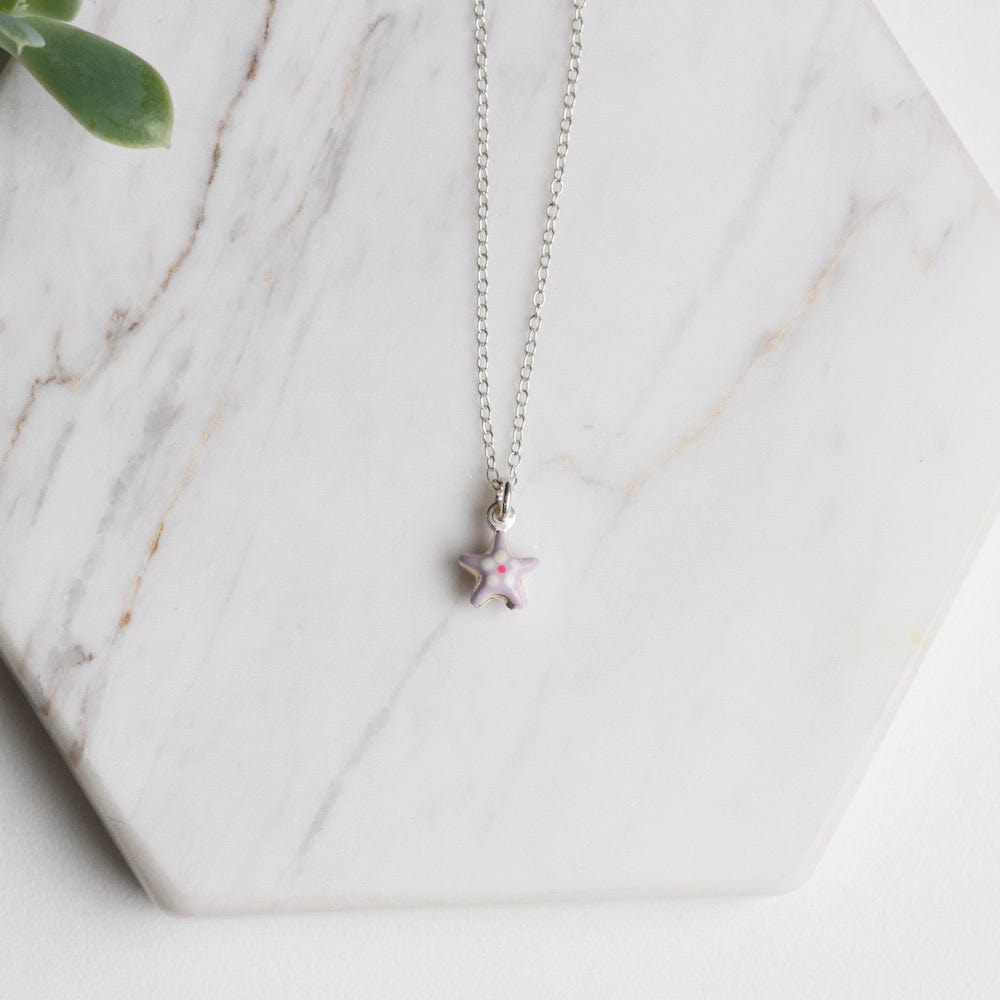 
                      
                        NKL Tiny Purple Star Necklace with Flower
                      
                    