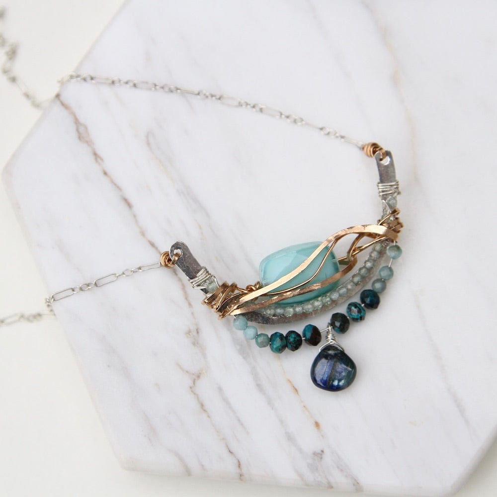 
                  
                    NKL Turquoise Crystal Arch Wrapped Necklace
                  
                