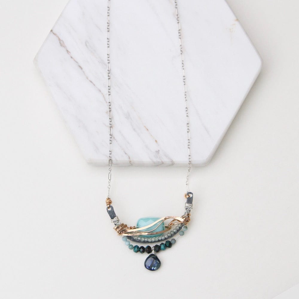 
                  
                    NKL Turquoise Crystal Arch Wrapped Necklace
                  
                