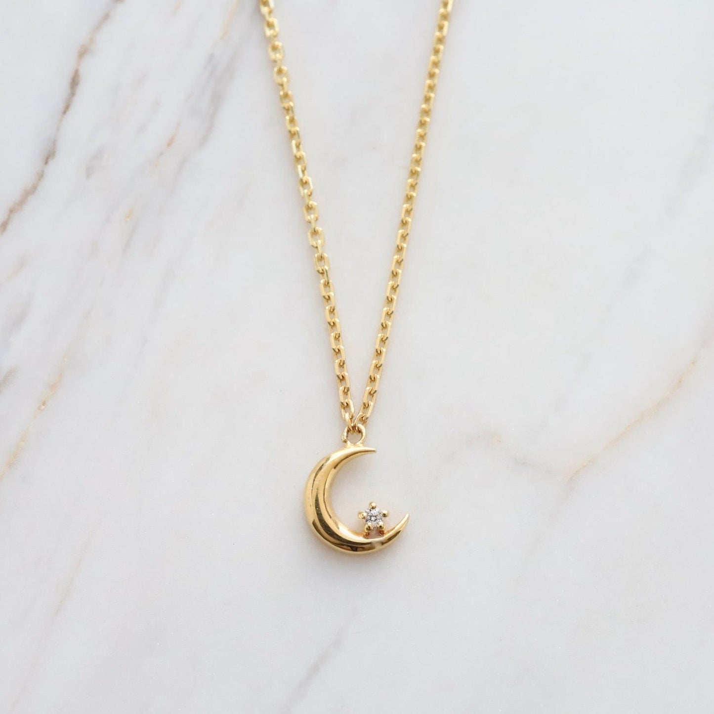 NKL-VRM Crescent Moon with Single CZ in Gold Vermeil