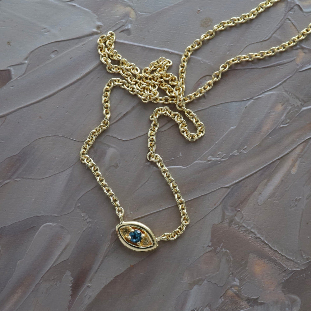 
                  
                    NKL-VRM Evil Eye with London Blue Topaz in Gold Vermeil
                  
                