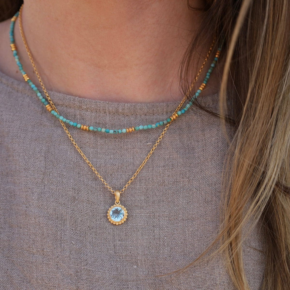 NKL-VRM Karma Blue Topaz Pendant Necklace