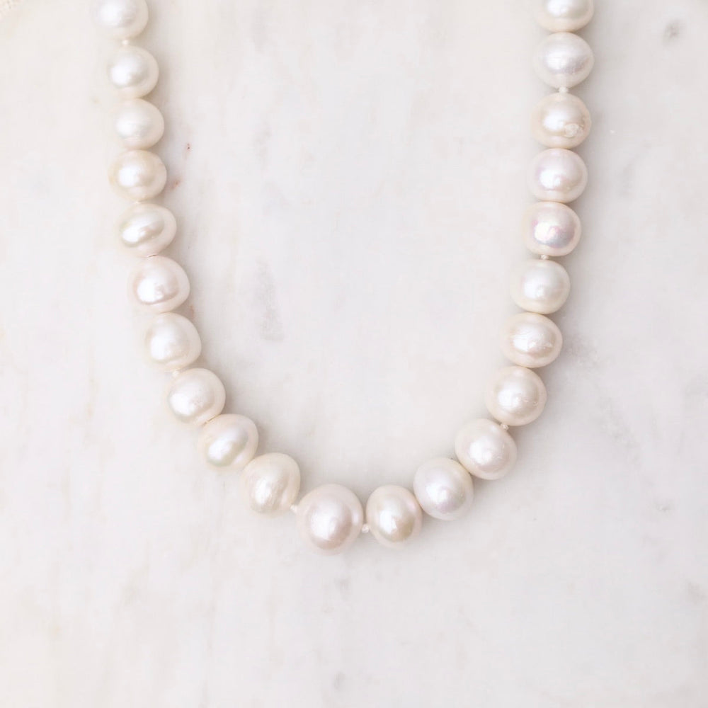 
                      
                        NKL White Pearl Necklace
                      
                    