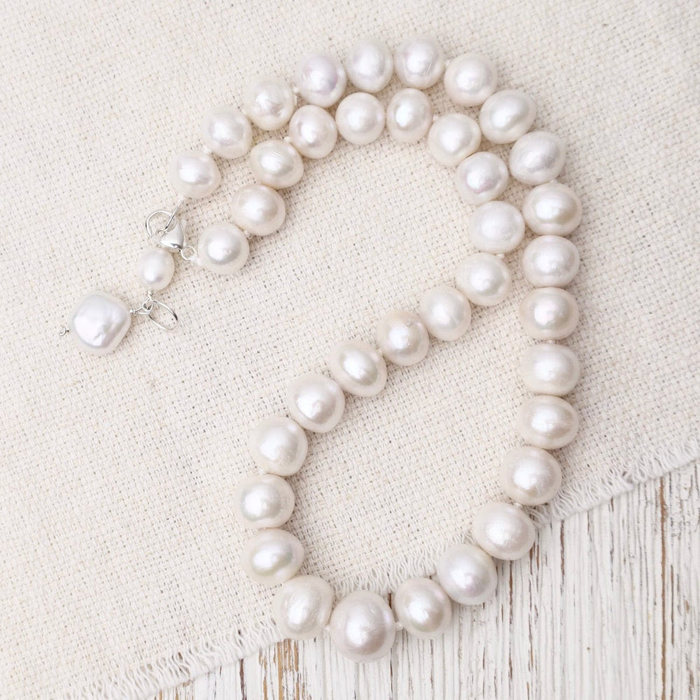 
                      
                        NKL White Pearl Necklace
                      
                    