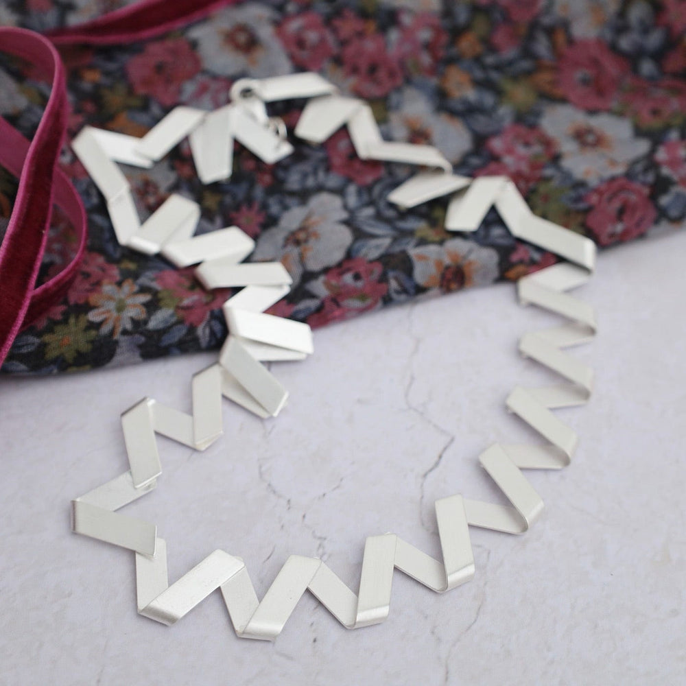 
                      
                        NKL Zig Zag Necklace
                      
                    