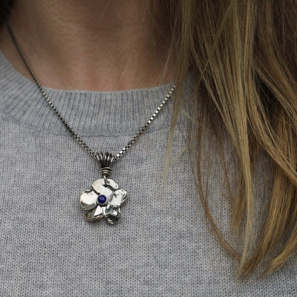 
                      
                        PND Lapis Stone Flower Pendant
                      
                    