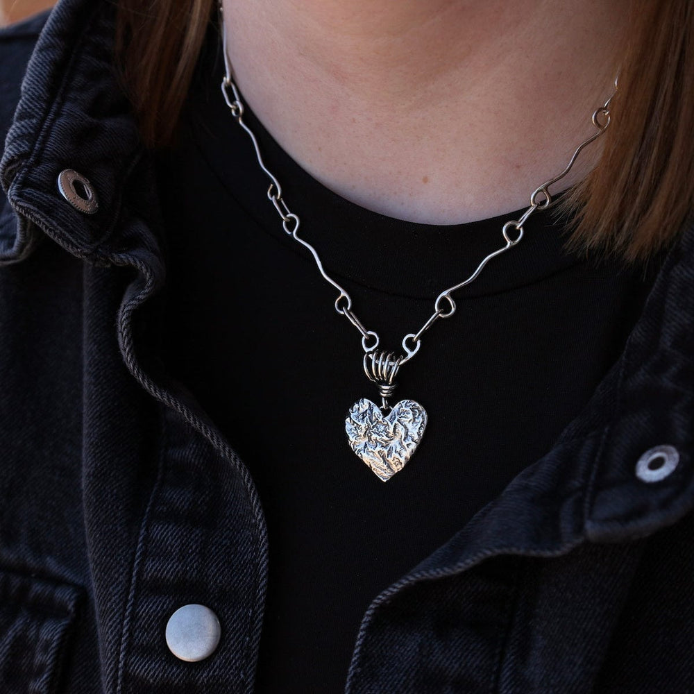 
                      
                        PND Reticulated Heart Pendant on Vine Bail
                      
                    